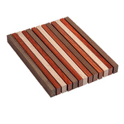 Wooden cutting board with striped pattern on a white background